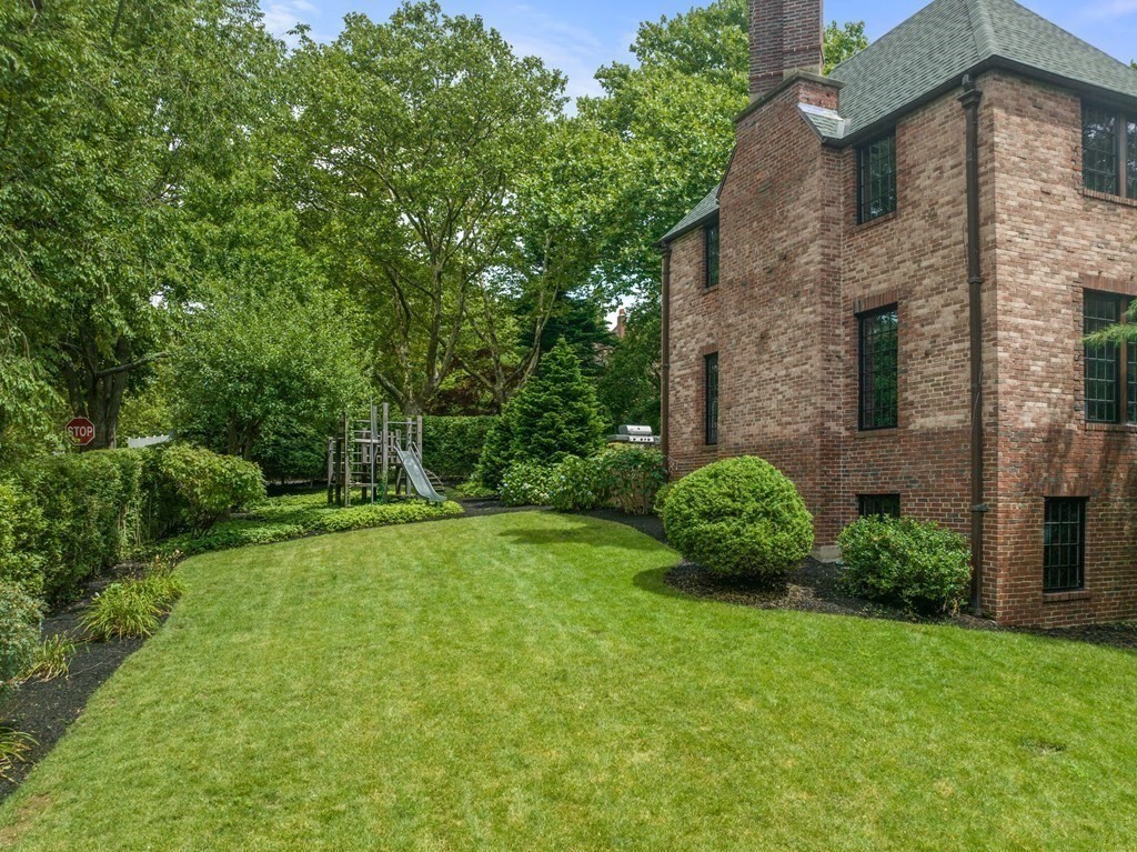 9 Penniman Road Brookline, MA 02445 - Photo 34 of 35 a view of a backyard with potted plants and large tree