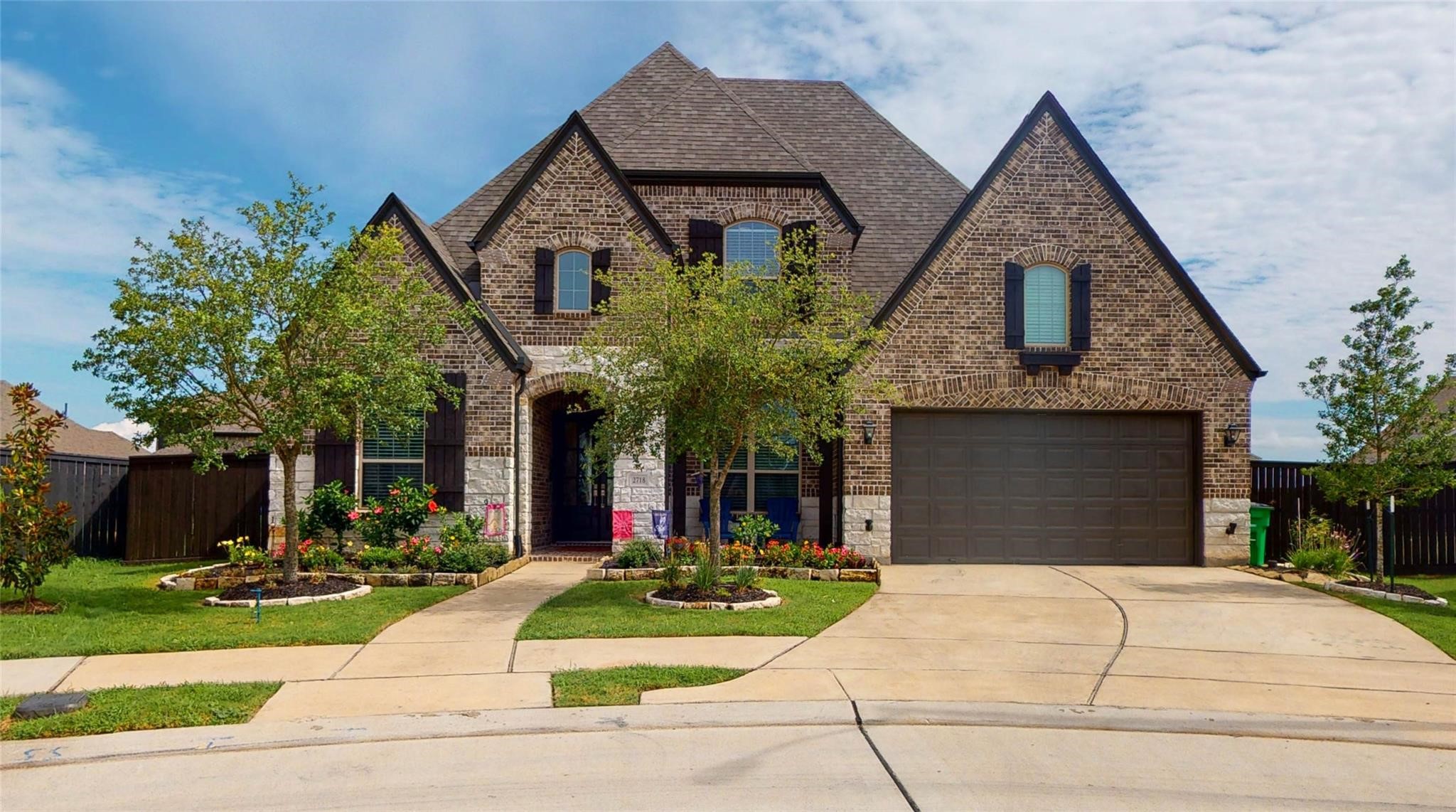 2718 Ripe Amber Cup Court Richmond, TX 77406 - Photo 1 of 43 a front view of house with a garden