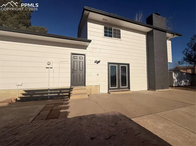 a view of a house with a wooden door