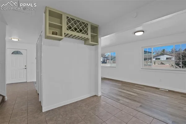 a kitchen with stainless steel appliances granite countertop a refrigerator a stove top oven a sink and dishwasher