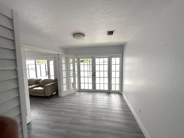 a living room with furniture and windows