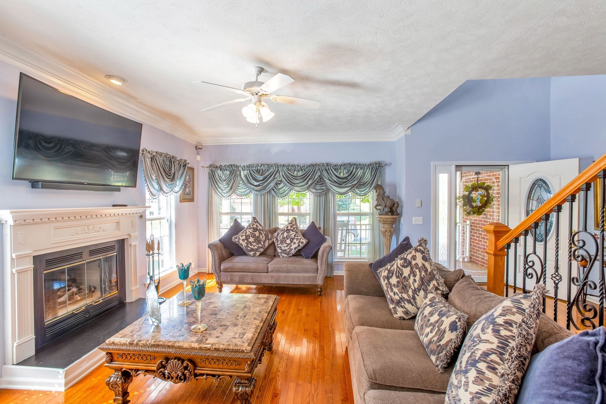 7344 Campton Road Nashville, TN 37211 - Photo 2 of 18 a living room with furniture fireplace and flat screen tv