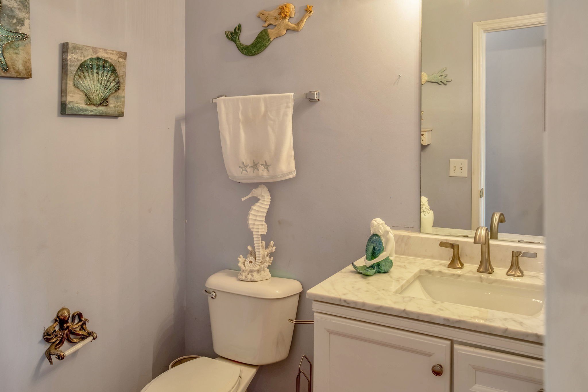 7344 Campton Road Nashville, TN 37211 - Photo 6 of 18 a bathroom with a toilet sink and mirror