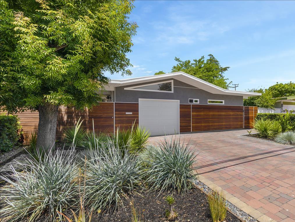 524 Thompson Avenue Mountain View, CA 94043 - Photo 2 of 34 a front view of house with yard and trees in the background