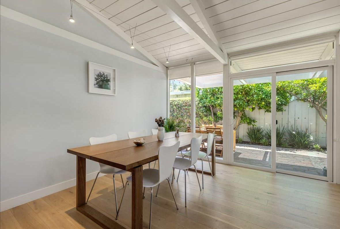 524 Thompson Avenue Mountain View, CA 94043 - Photo 12 of 34 a view of a dining room with furniture wooden floor and floor to ceiling window