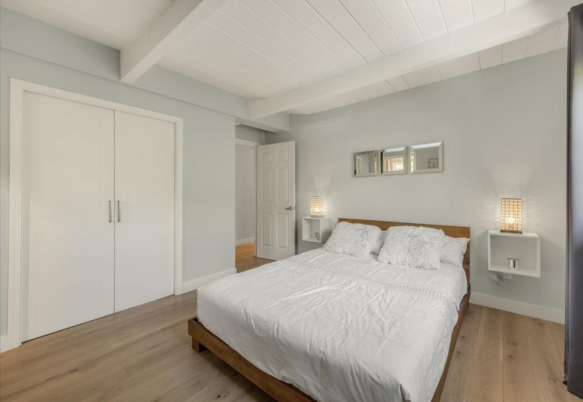 524 Thompson Avenue Mountain View, CA 94043 - Photo 16 of 34 a large bed in a white room