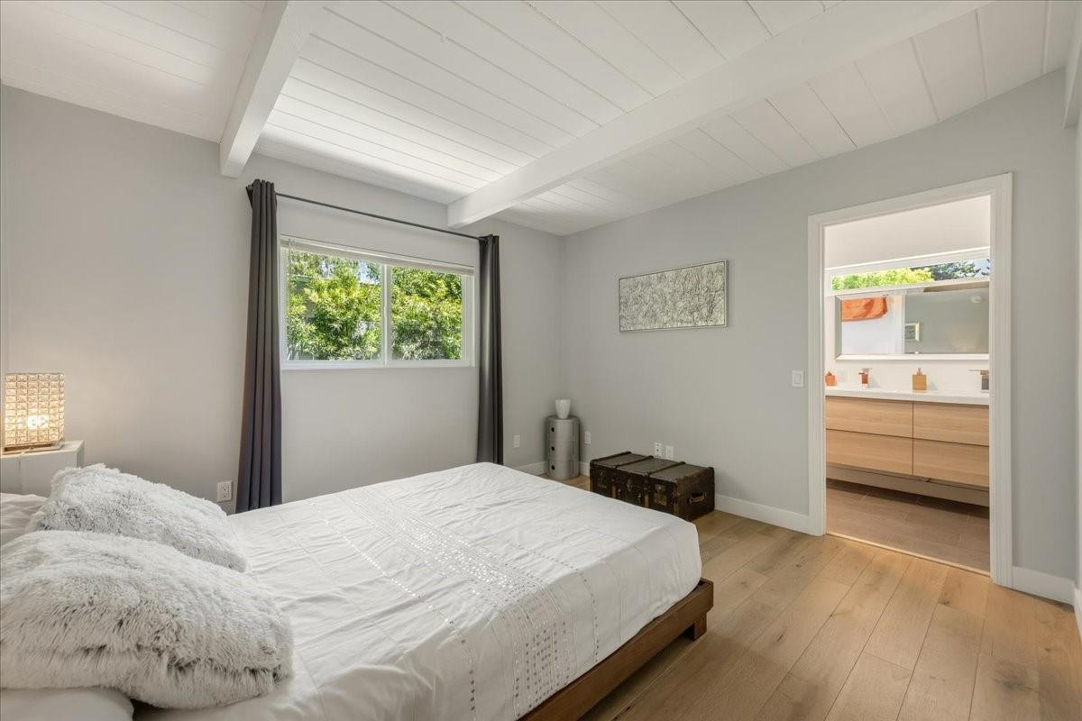 524 Thompson Avenue Mountain View, CA 94043 - Photo 17 of 34 a bedroom with a bed and a window