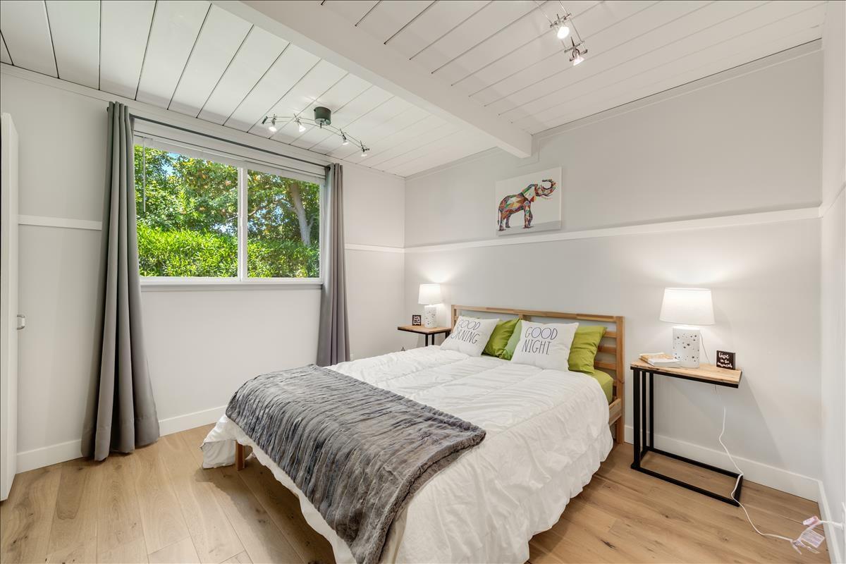 524 Thompson Avenue Mountain View, CA 94043 - Photo 22 of 34 a bedroom with a bed and a window