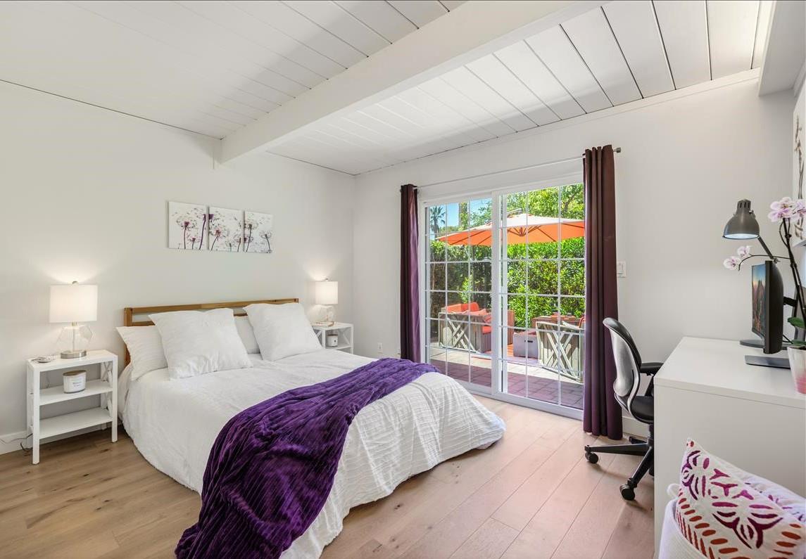 524 Thompson Avenue Mountain View, CA 94043 - Photo 27 of 34 a bedroom with a bed and a flat tv screen next to a window