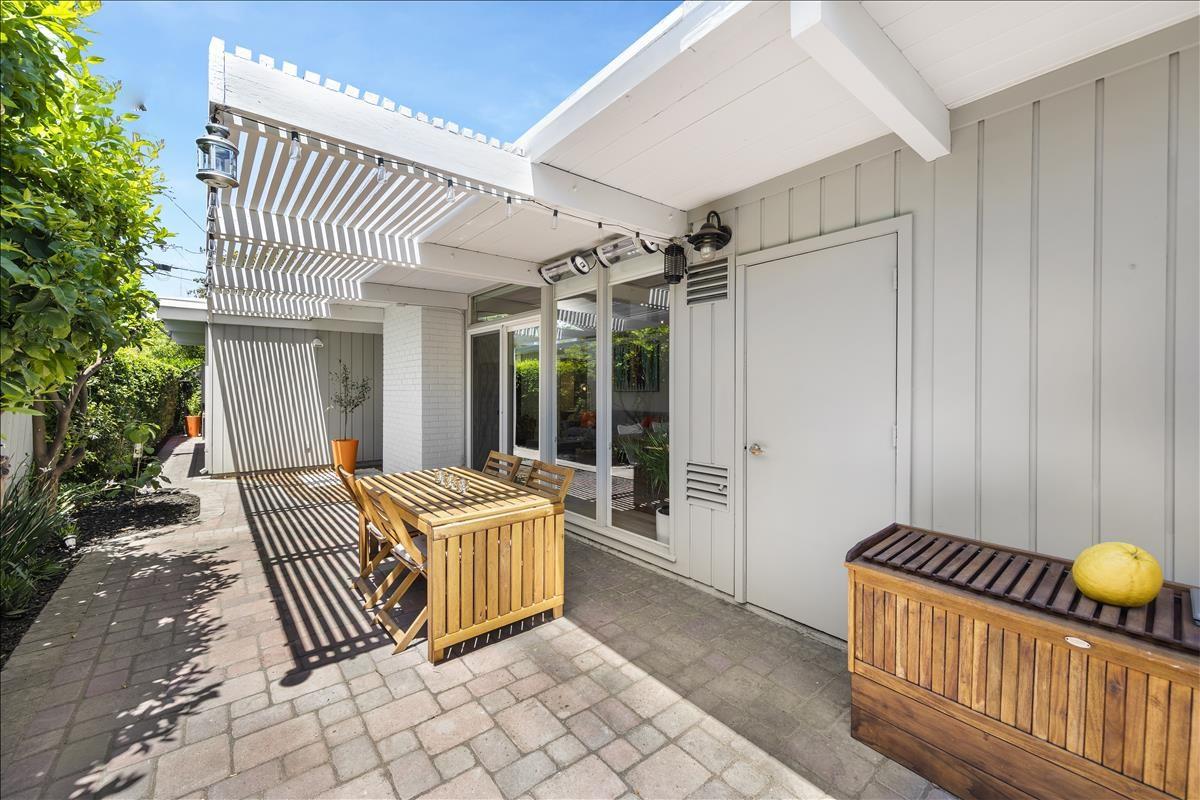 524 Thompson Avenue Mountain View, CA 94043 - Photo 31 of 34 a view of a patio with a table and chairs