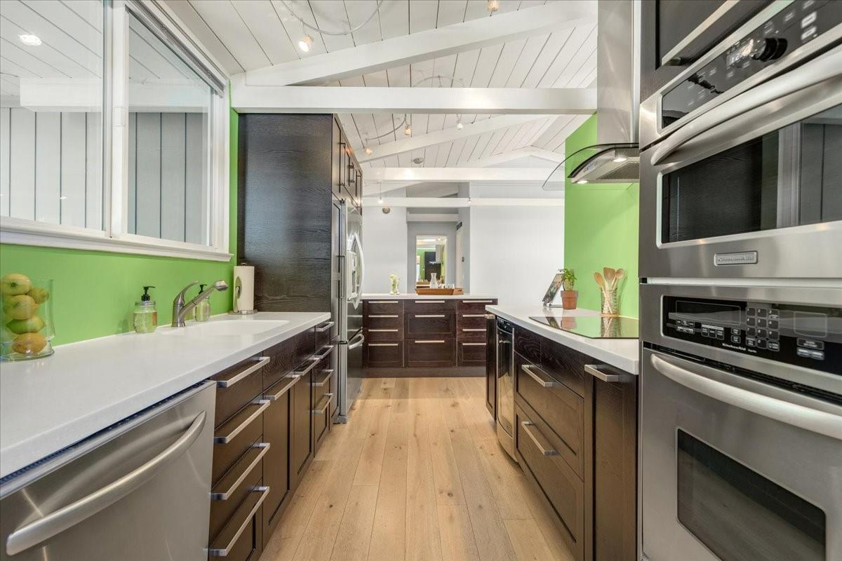 524 Thompson Avenue Mountain View, CA 94043 - Photo 5 of 34 a kitchen with a sink and a stove top oven