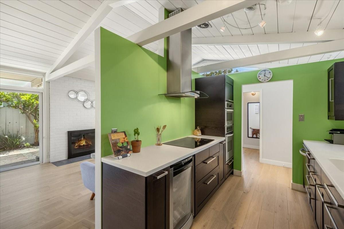 524 Thompson Avenue Mountain View, CA 94043 - Photo 6 of 34 a kitchen with a sink stove and cabinets