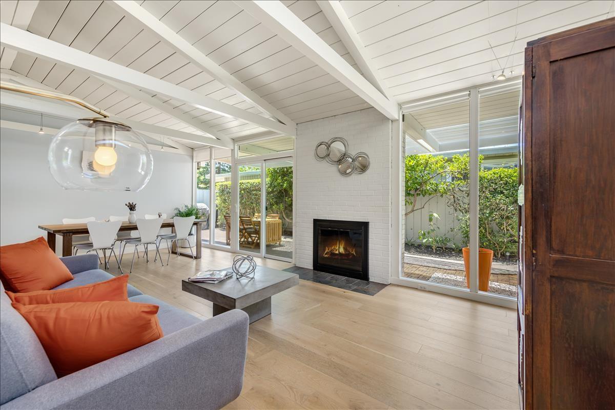 524 Thompson Avenue Mountain View, CA 94043 - Photo 9 of 34 a living room with furniture a fireplace and a large window