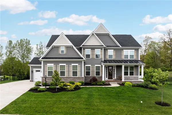 front view of a house with a yard