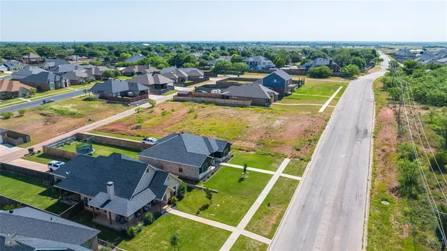 an aerial view of a house with a ocean view