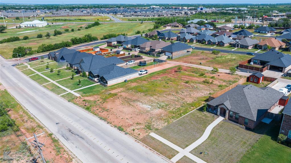 4102 Forrest Hill Road Abilene, TX 79606 - Photo 4 of 9 an aerial view of a house with a swimming pool yard and outdoor seating