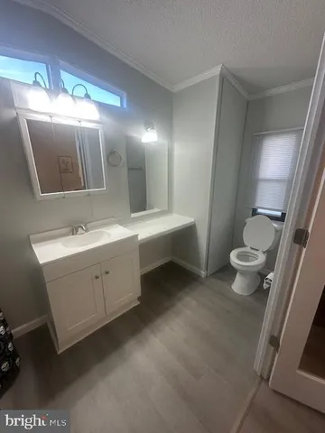 a bathroom with a double vanity sink and mirror