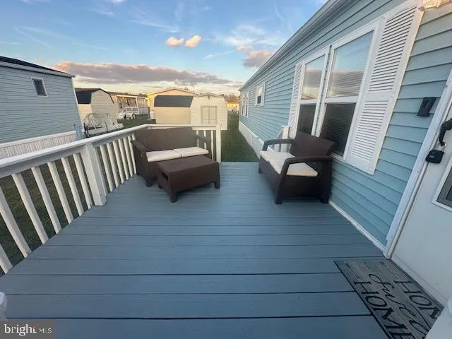 a view of roof deck with patio