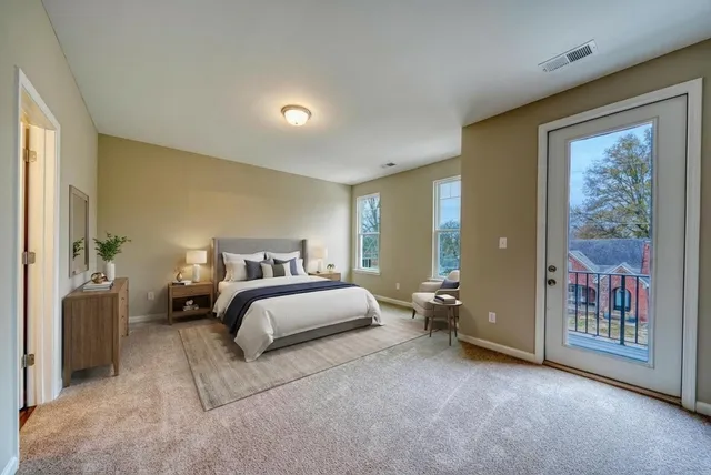 a bed room with a bed and a large window