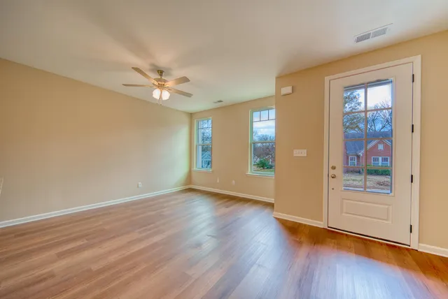 a view of kitchen with cabinets and wooden floor