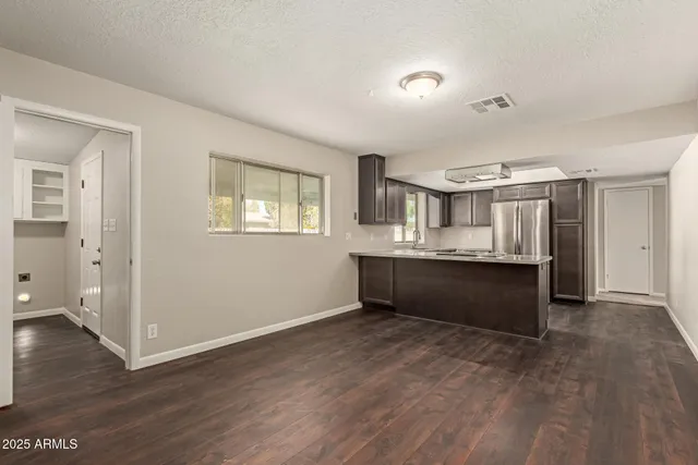 a view of kitchen with wooden floor