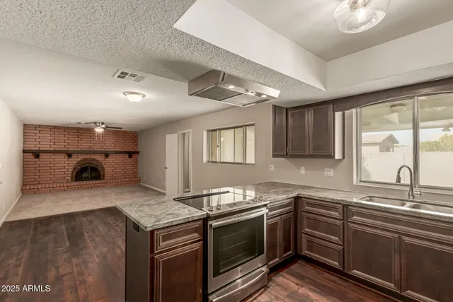 a kitchen with a stove and a sink