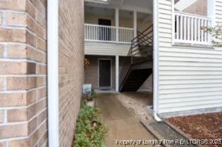 a view of a house with a door and wooden floor