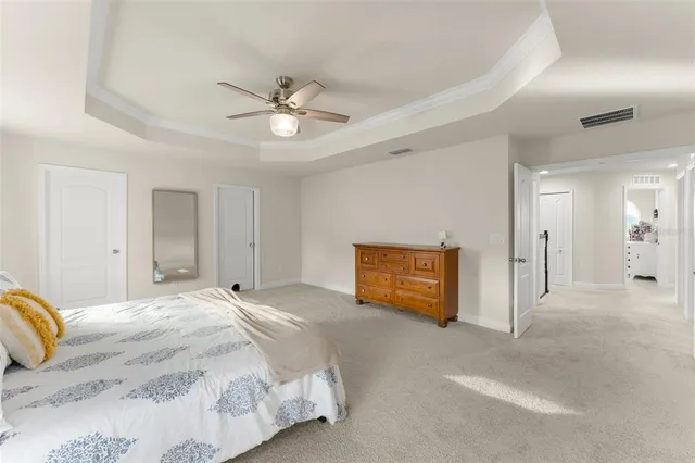 a view of walk in closet with clothes