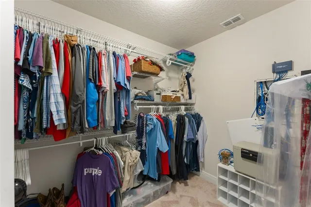 a bathroom with a granite countertop sink a mirror and a bathtub