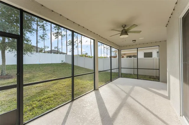 a view of a big yard with palm trees