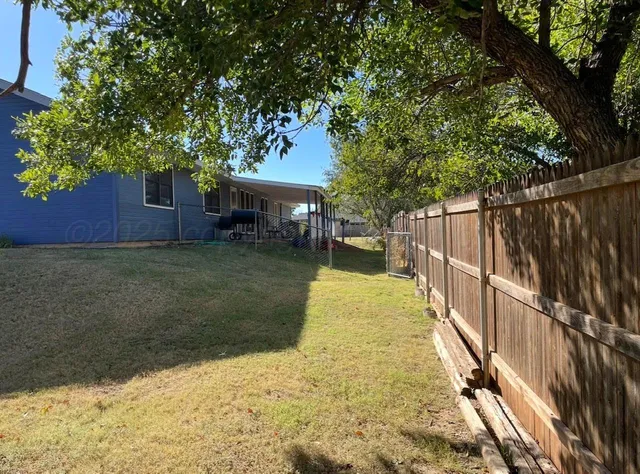a house with trees in the background