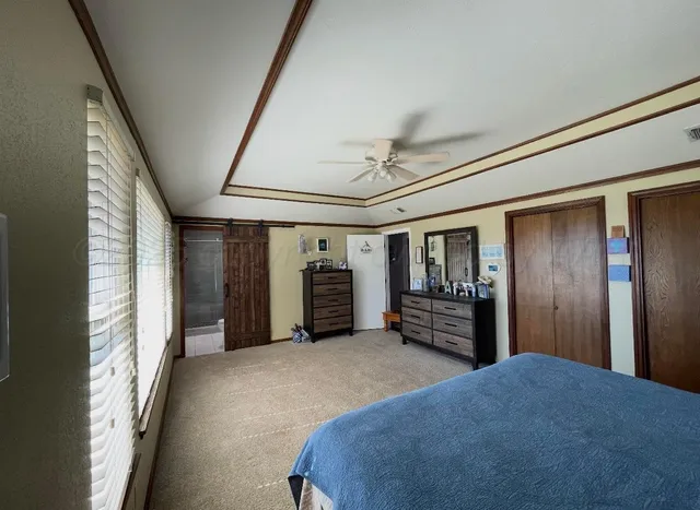 a bedroom with furniture and window