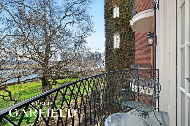 a bedroom with a bed dresser and a large window
