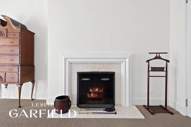 a bathroom with a tub a sink and mirror