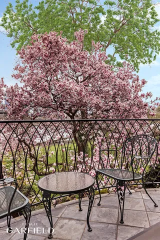 a view of a balcony with chairs