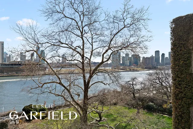 a living room with patio furniture and a large window
