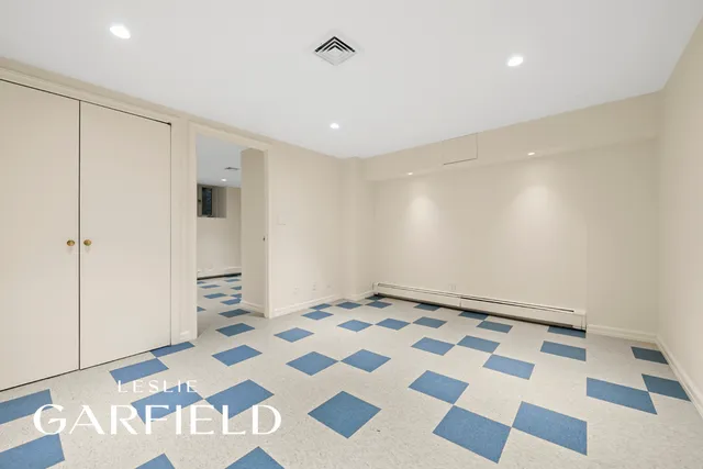 a view of a house with a yard and potted plants