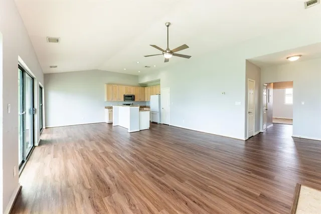 a view of kitchen with cabinets and wooden floor