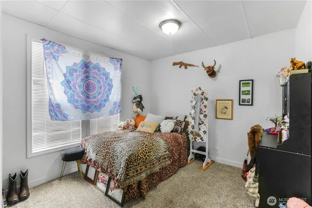 a bed room with a bed and a window