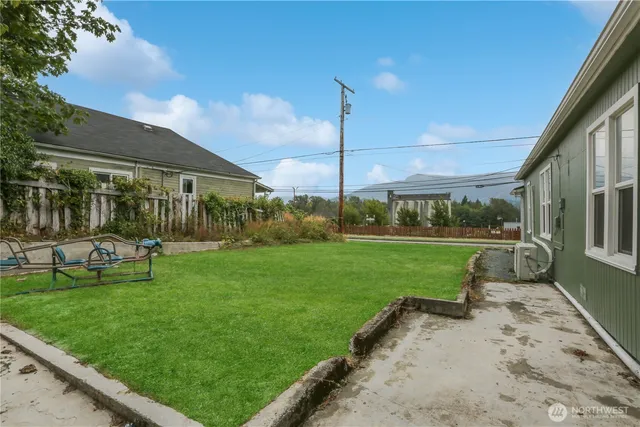 a view of a park with large trees