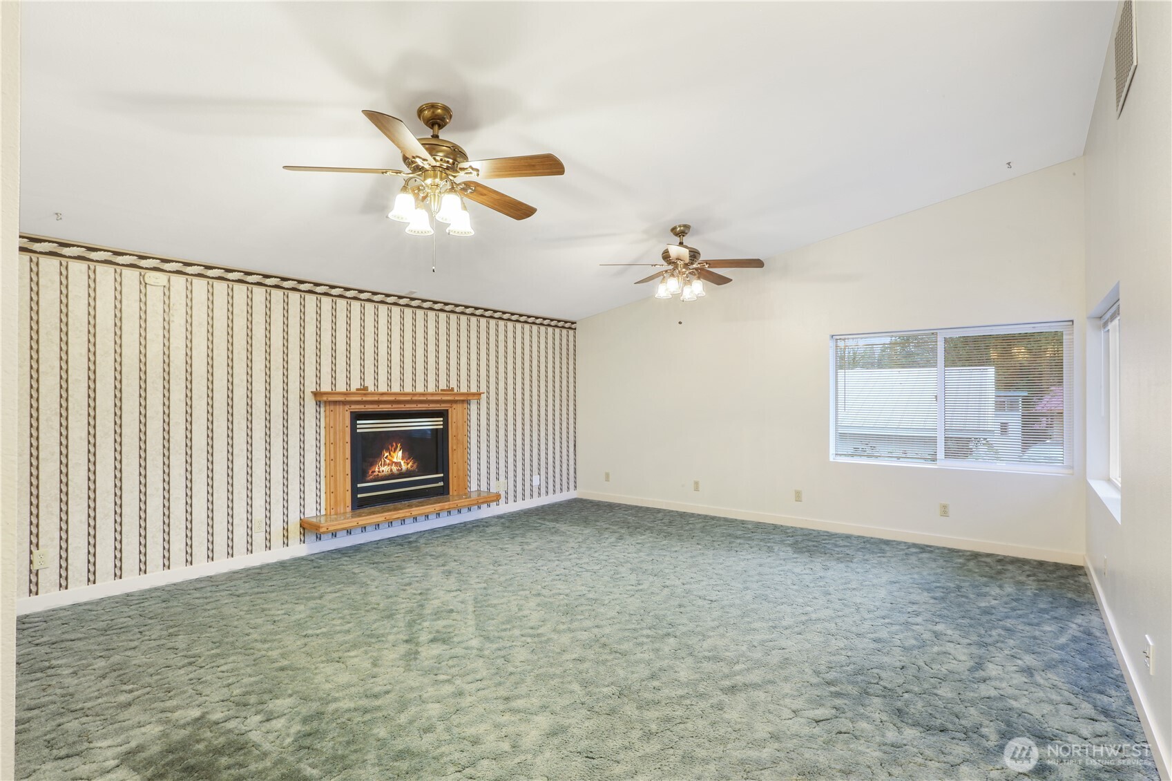 45337 Main Street Concrete, WA 98237 - Photo 24 of 40 an empty room with windows and fan