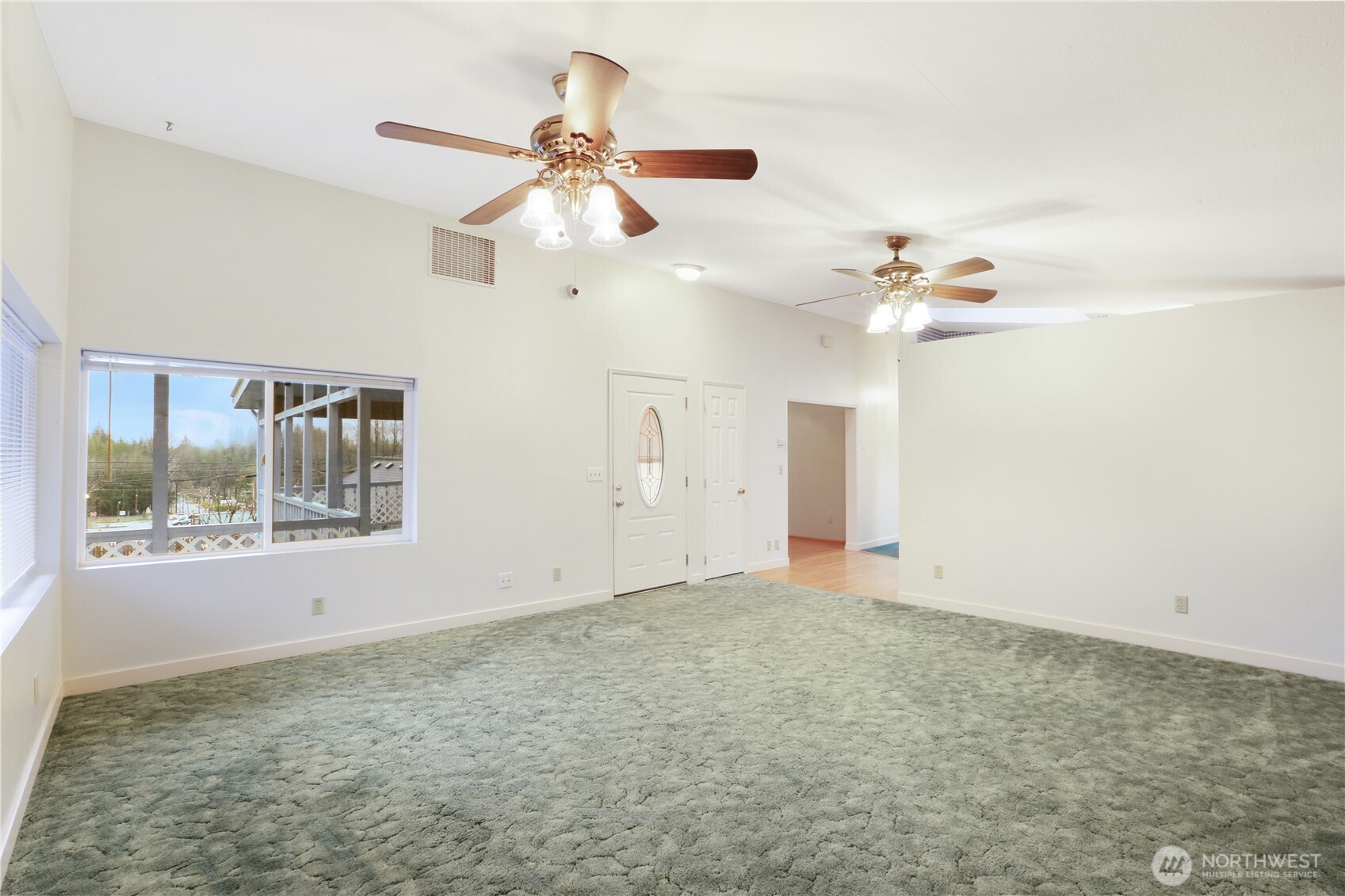 45337 Main Street Concrete, WA 98237 - Photo 26 of 40 an empty room with a window and a fan