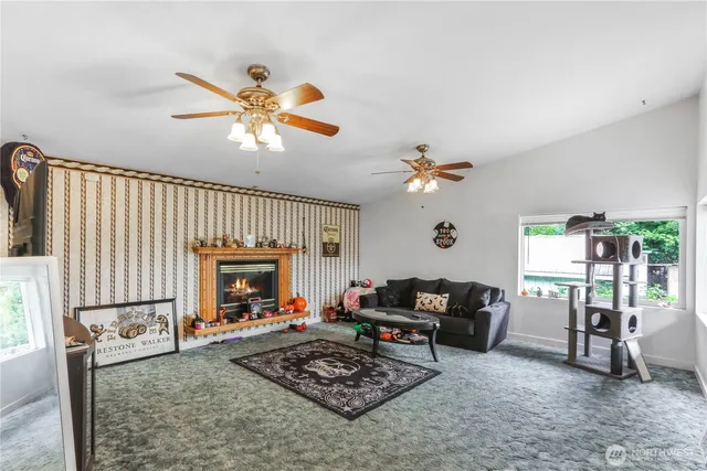a living room with furniture a rug and a chandelier