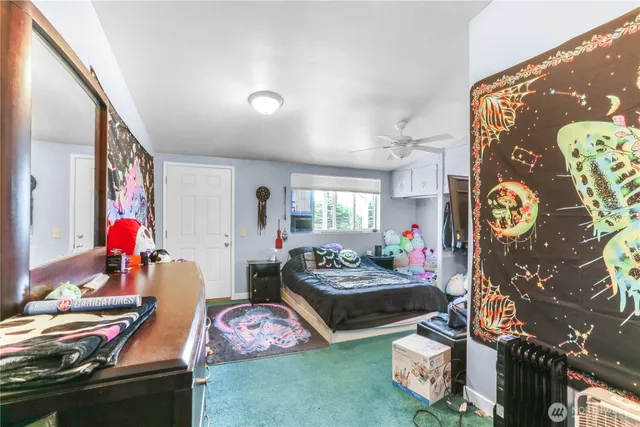 a bedroom with furniture and a window