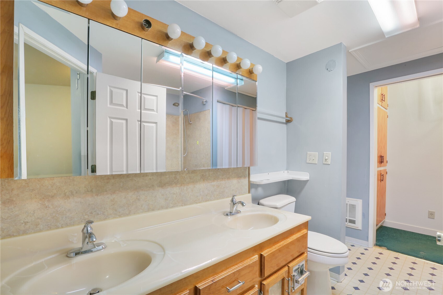 45337 Main Street Concrete, WA 98237 - Photo 33 of 40 a bathroom with a sink a toilet and a mirror