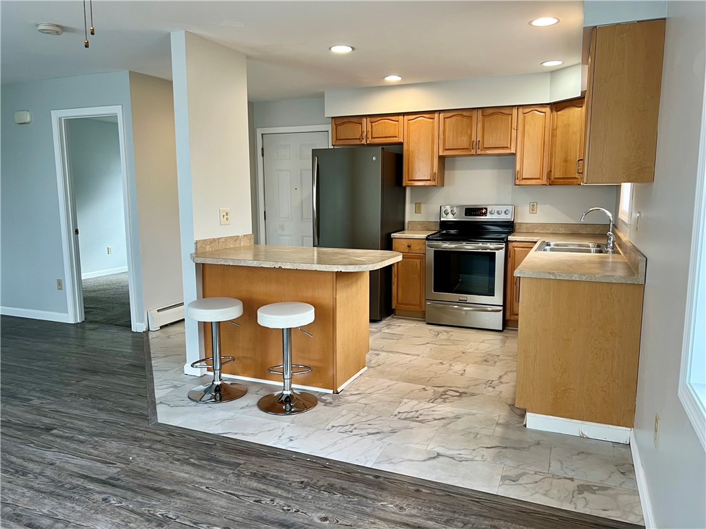 51 Walnut Street, Unit 2 Tiverton, RI 02878 - Photo 1 of 13 Kitchen with island seating