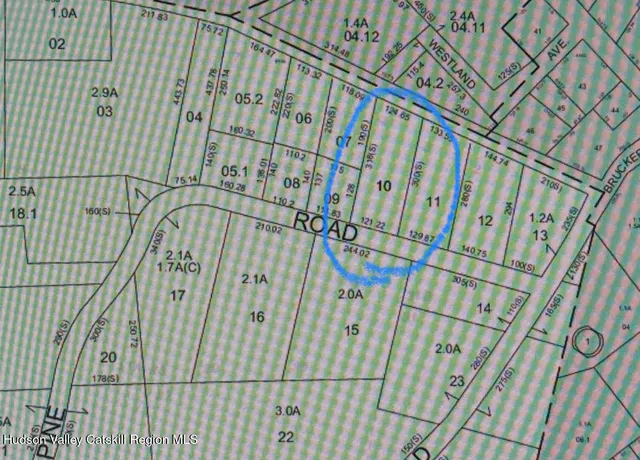 a aerial view of a house with garden space and street view