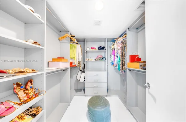 a view of a dining room with furniture and a window