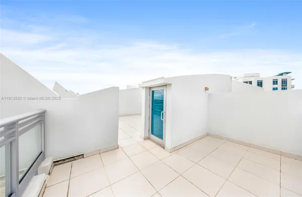 a large kitchen with a refrigerator a stove top oven a sink and dishwasher