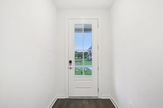a view of entryway with wooden floor